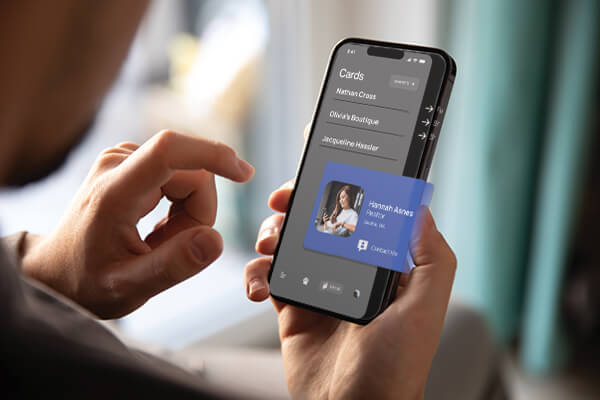 Person tapping a digital business card on a smartphone in the Cardtapp app